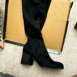 Over the knee heel boot.